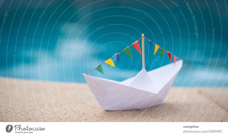 Paper ship with party pennant chain at the water Joy Healthy Life Far-off places Freedom Cruise Summer Summer vacation Sun Beach Ocean Entertainment Party Event