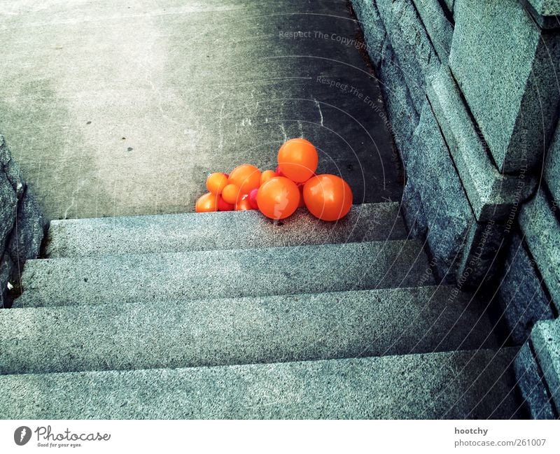 After show party. Balloon Decoration Orange Colour photo Exterior shot Lie Stairs Deserted Gray Leave behind