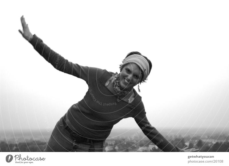 jet fighter Woman Fidget Headscarf Meadow Hill Village House (Residential Structure) Blur Black & white photo Funny Legs Mountain Lawn Laughter Flying Arm