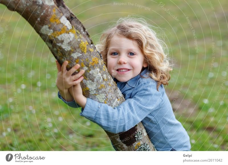 Happy small child with long blond hair hugging a tree Beautiful Face Summer Child Human being Baby Boy (child) Man Adults Infancy Environment Nature Plant Tree