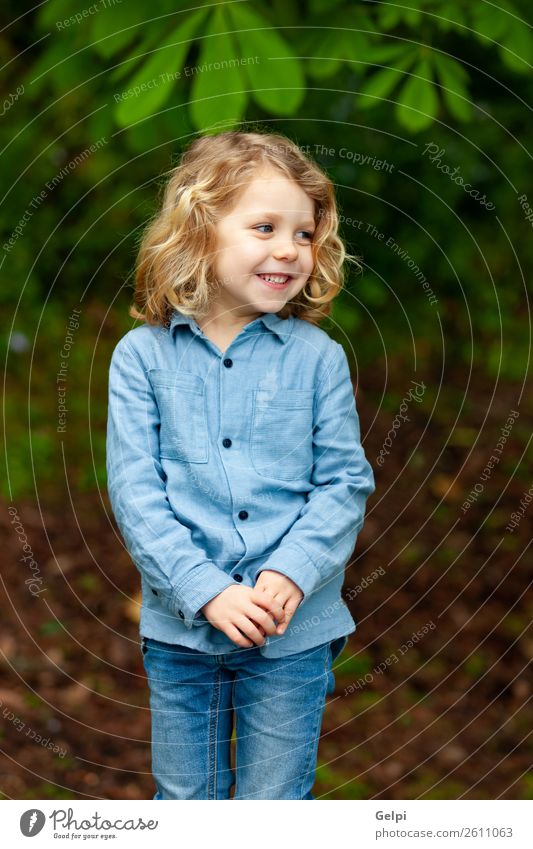 Happy small child with long blond hair Beautiful Face Summer Child Human being Baby Boy (child) Man Adults Infancy Environment Nature Plant Shirt Blonde Smiling