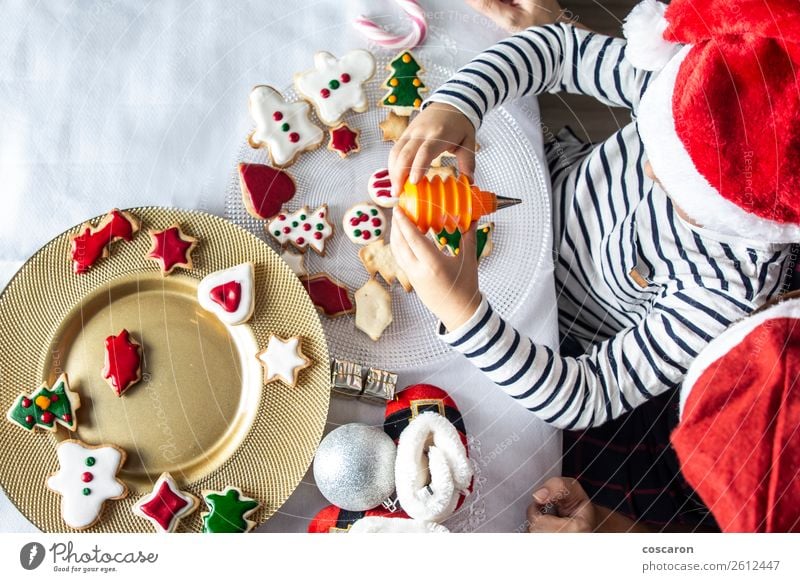 Mother and son decorating Christmas biscuits at home Cake Dessert Candy Lifestyle Joy Happy Beautiful Winter House (Residential Structure) Decoration Kitchen