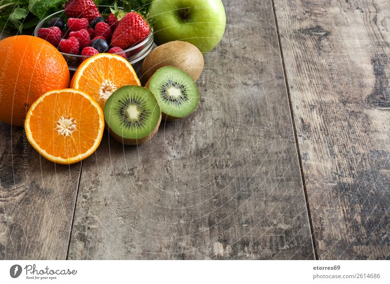 Mixed fruits on a rustic wooden table Fruit Diet Fresh Colour Multicoloured Dessert Neutral Background Sweet Lemon Organic Raw Food Healthy Eating