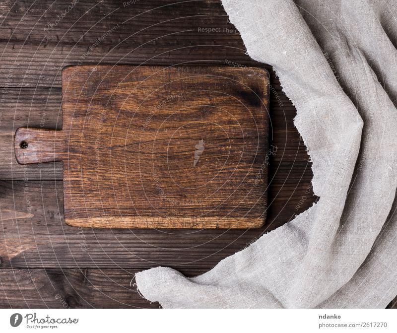 Premium Photo  Empty round kitchen wooden cutting board in brown color on  a dark textured concrete background