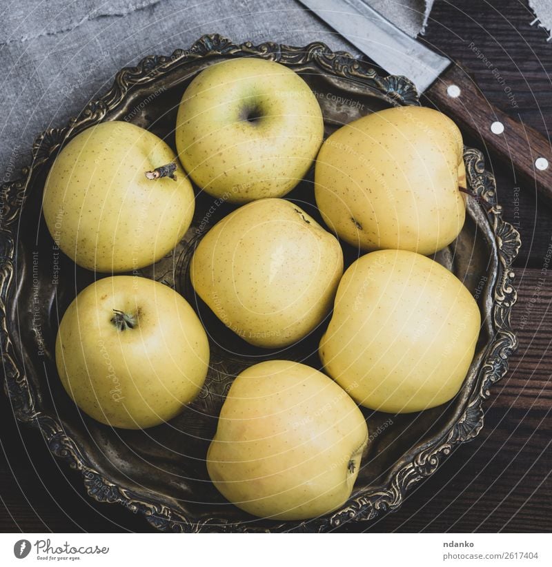 ripe whole yellow apples Fruit Apple Dessert Nutrition Vegetarian diet Diet Juice Plate Knives Table Nature Eating Fresh Yellow Green background healthy food