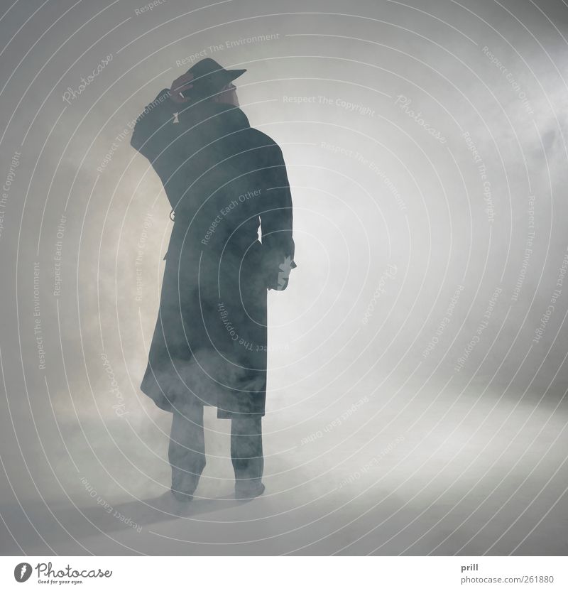 Woman wearing trench coat and standing in fog Exotic Human being Fog Coat Hat Smoke Observe Stand Wait Simple Anticipation Trust Serene Loneliness Mistrust