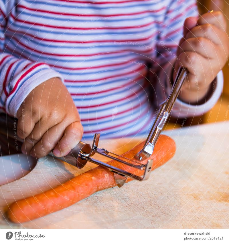 Children hands peel a carrot Vegetable Nutrition Eating Organic produce Vegetarian diet Parenting Kindergarten Study Cook Toddler Girl Boy (child) Infancy