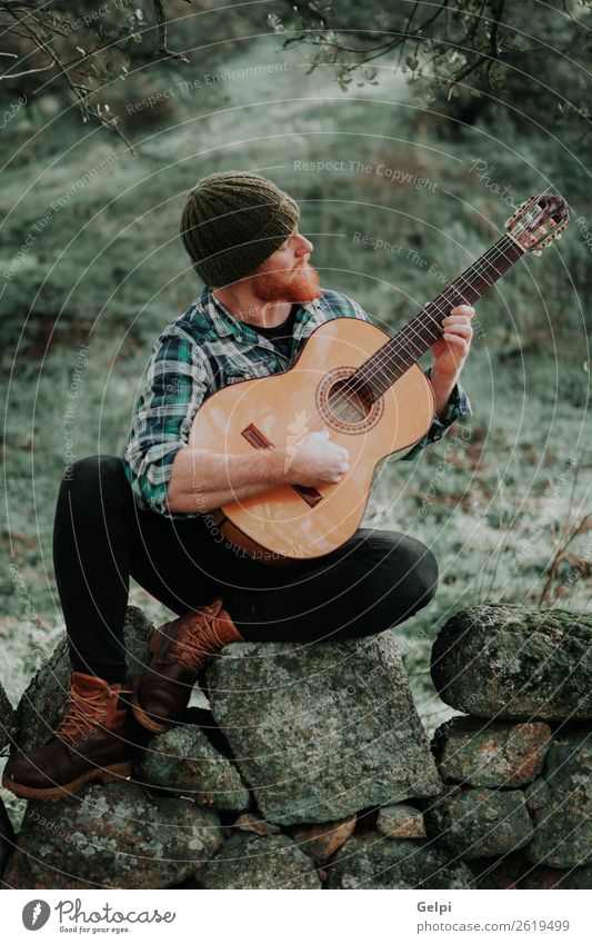 Hipster man with red beard Leisure and hobbies Playing Entertainment Music Human being Man Adults Musician Guitar Nature Hat Red-haired Moustache Cool (slang)