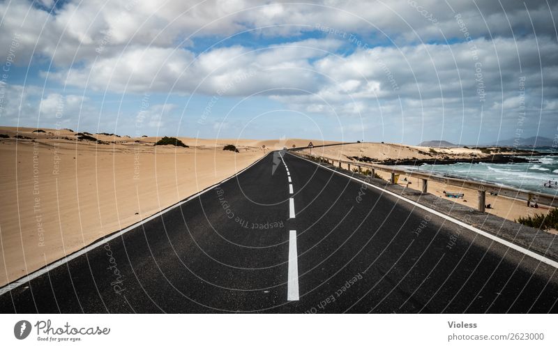 Highway to ..... Sand Sky Clouds Waves Coast Ocean Island Desert Traffic infrastructure Street Discover Driving Black Fuerteventura Corralejo Traffic lane