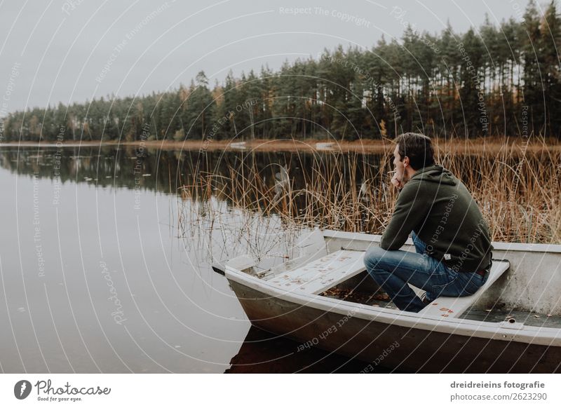 Man sits in boat by the lake Vacation & Travel Adventure Human being Adults Nature Autumn Lake River Relaxation Smoking Sit Dream Wait Authentic Natural Happy