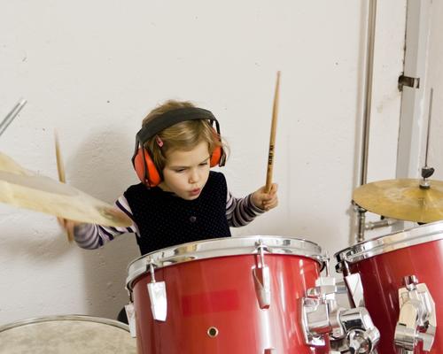 rock concert girl Child Toddler Infancy Playing Joy Drum set Music Musical instrument headphones Ear protectors Leisure and hobbies Make music play music Sound
