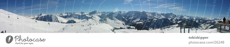 Alpine panorama while skiing Leisure and hobbies Trip Far-off places Winter Snow Mountain Sports Winter sports Skiing Alps Peak Cable car Large Top terminal