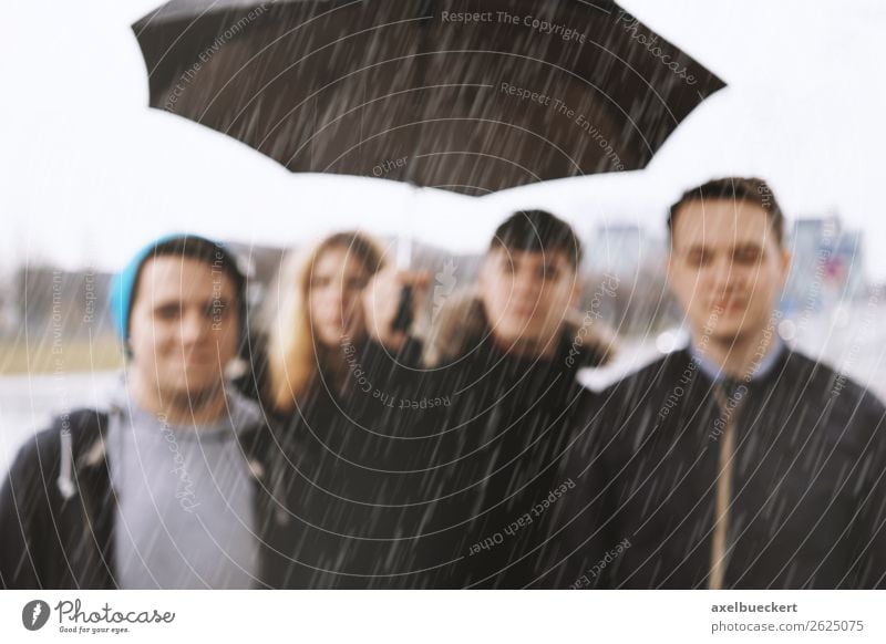 Friends in the rain - defocused Lifestyle Human being Young woman Youth (Young adults) Young man Woman Adults Man 4 Group 13 - 18 years 18 - 30 years Weather
