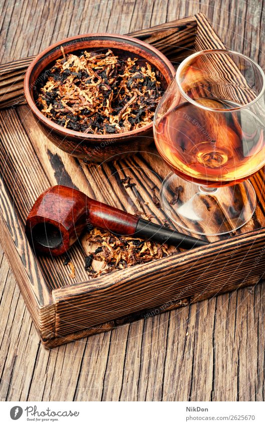 Tobacco pipe and whiskey tobacco smoke nicotine addiction brown vintage smoker classic alcohol drink cognac glass brandy scotch liquor beverage spirit whisky