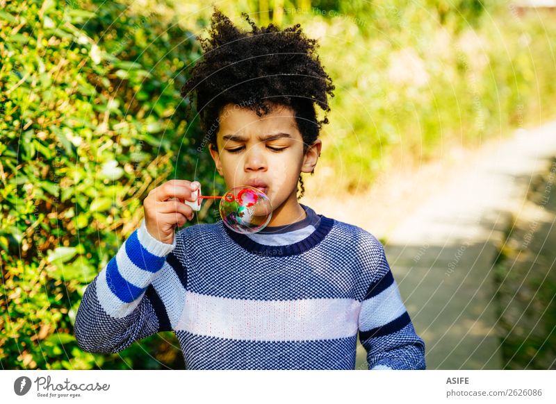 Cute little boy blowing bubbles outdoor Joy Happy Leisure and hobbies Playing Garden Child Boy (child) Man Adults Infancy Mouth Lips Nature Autumn Park