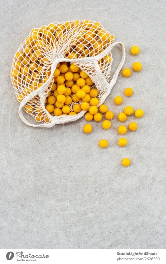 Yellow plums in a cotton mesh bag Food Fruit Nutrition Lifestyle Shopping Healthy Eating Leisure and hobbies Summer Garden Gardening Agriculture Forestry Nature