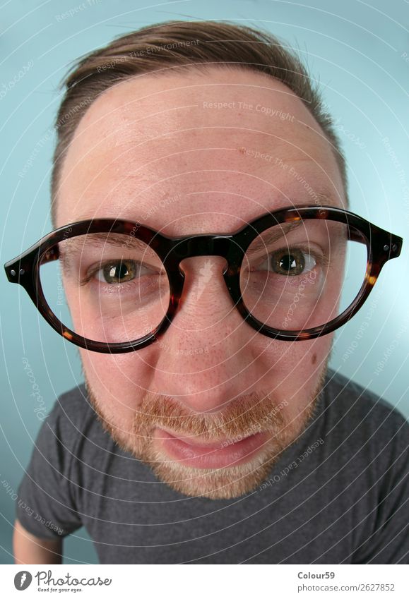 Man with glasses Human being 1 Funny Near Crazy Joy portrait nerd Comic Doofus Eyeglasses Wide angle Grimace eyes Beard warped Colour photo Close-up