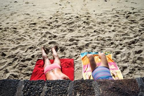 sunbath Vacation & Travel Summer Summer vacation Sun Sunbathing Beach Ocean Human being Masculine Feminine Woman Adults Man Female senior Male senior