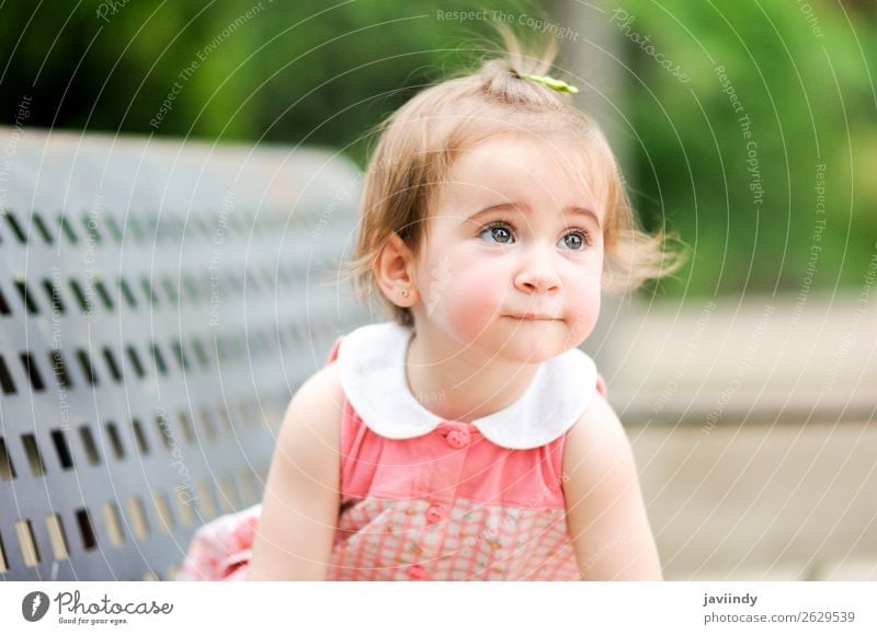 Adorable little girl playing in a urban park Lifestyle Joy Happy Beautiful Leisure and hobbies Playing Summer Child Human being Baby Girl Woman Adults Infancy 1
