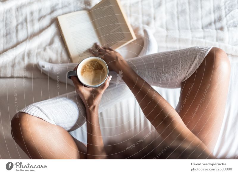 woman reading a book and drinking coffee on bed with socks Woman Bed Sock Book Reading Coffee Tights Legs Girl White Black Smiling Soft Cup Comfortable Morning