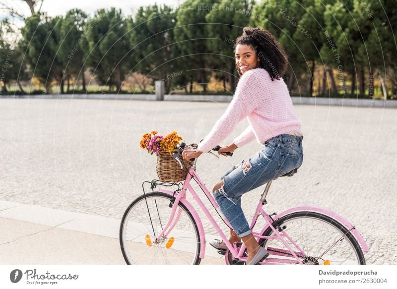 Black young woman riding a vintage bicycle Bicycle Girl Woman Vintage Ride Beautiful Retro Flower Happy Bouquet Summer Youth (Young adults) pretty Spring Basket