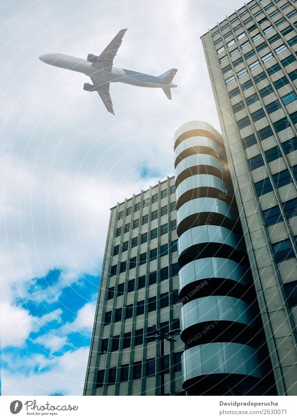 Plane flying over building Airplane Sky Aircraft Aviation Flying City Air Traffic Control Tower Airport from below Architecture Building Departure Landing Town