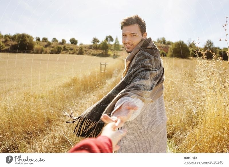 Man holding his couple's hand in a field Lifestyle Elegant Style Joy Wellness Harmonious Human being Masculine Young man Youth (Young adults) Adults