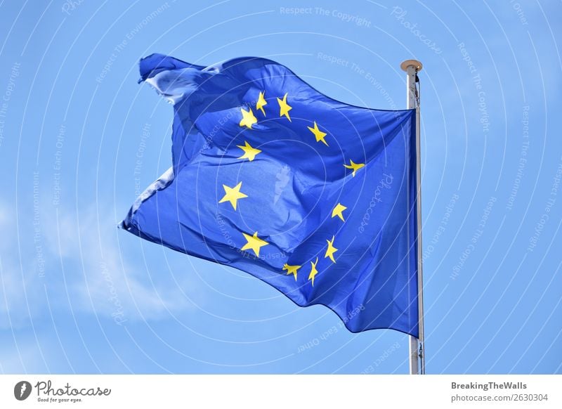 Close up flag of EU waving in wind over blue sky Sky Clouds Wind Sign Signs and labeling Flag Flying Blue Attachment European Vantage point Flap Blow national