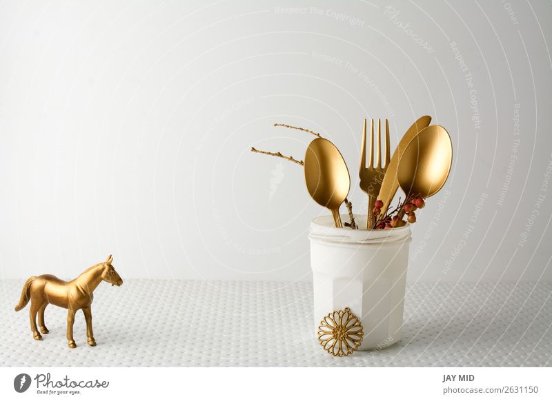 Festive golden cutlery knife and fork spoon in a white bottle Lunch Dinner Bottle Cutlery Fork Spoon Elegant Design Decoration Table Kitchen Restaurant