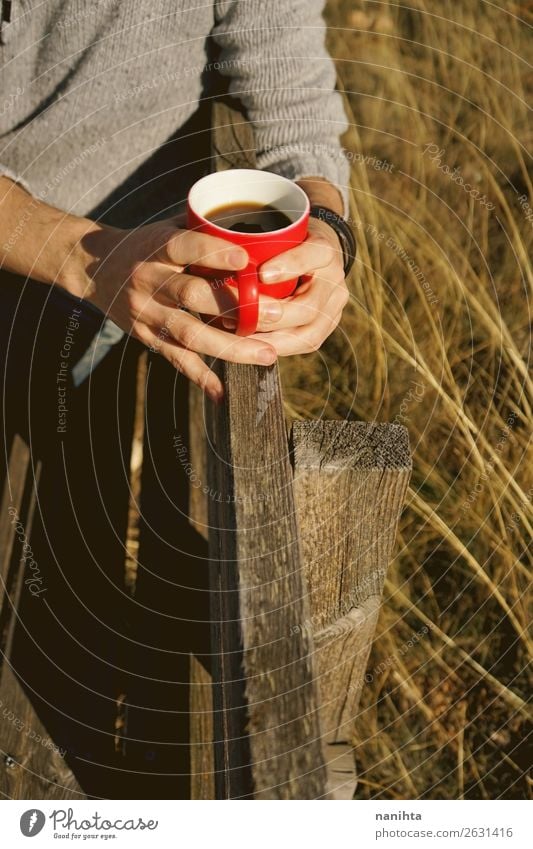Man holding a cup of coffee in a wooden bench Breakfast Beverage Drinking Hot drink Hot Chocolate Coffee Tea Cup Lifestyle Healthy Healthy Eating Wellness