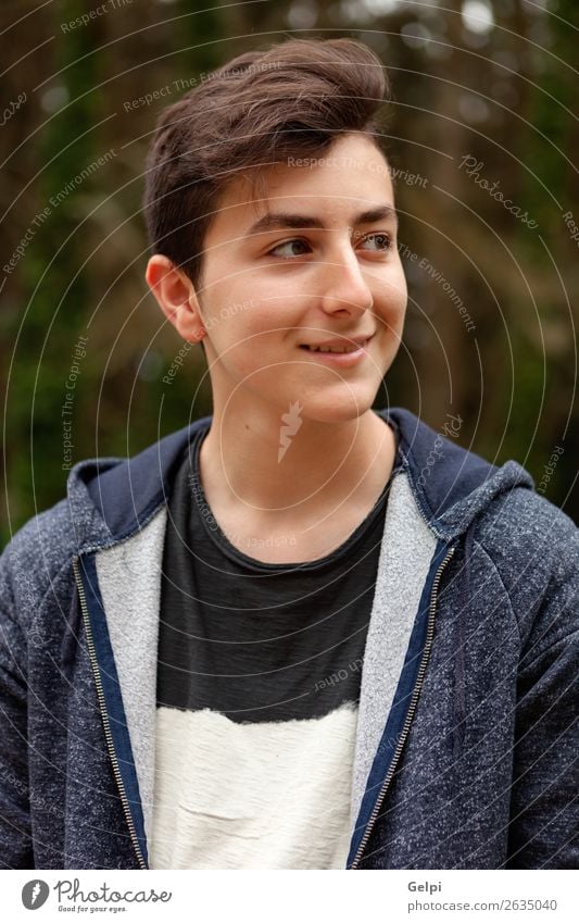 Attractive teenager guy in a park Lifestyle Style Happy Beautiful Hair and hairstyles Face Summer Human being Boy (child) Man Adults Youth (Young adults) Nature