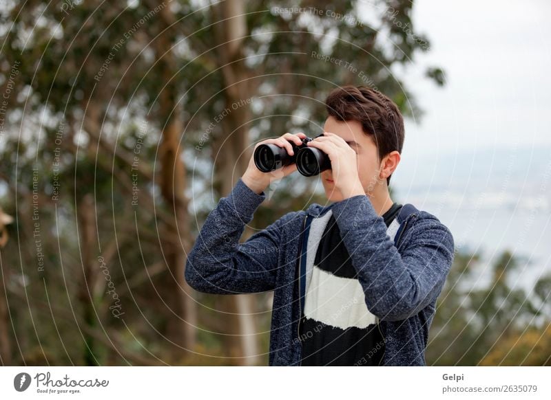Teenager guy looking with binoculars Lifestyle Joy Happy Leisure and hobbies Summer Child Human being Boy (child) Man Adults Infancy Youth (Young adults) Hand