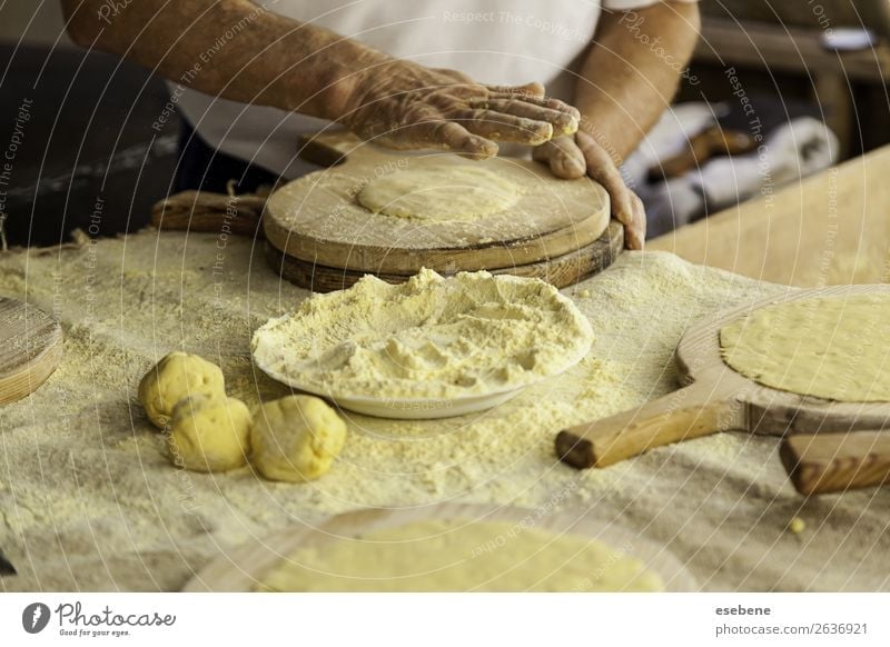Kneading dough in a traditional bakery Dough Baked goods Bread Eating Table Kitchen Restaurant Work and employment Human being Woman Adults Man Hand Wood Make