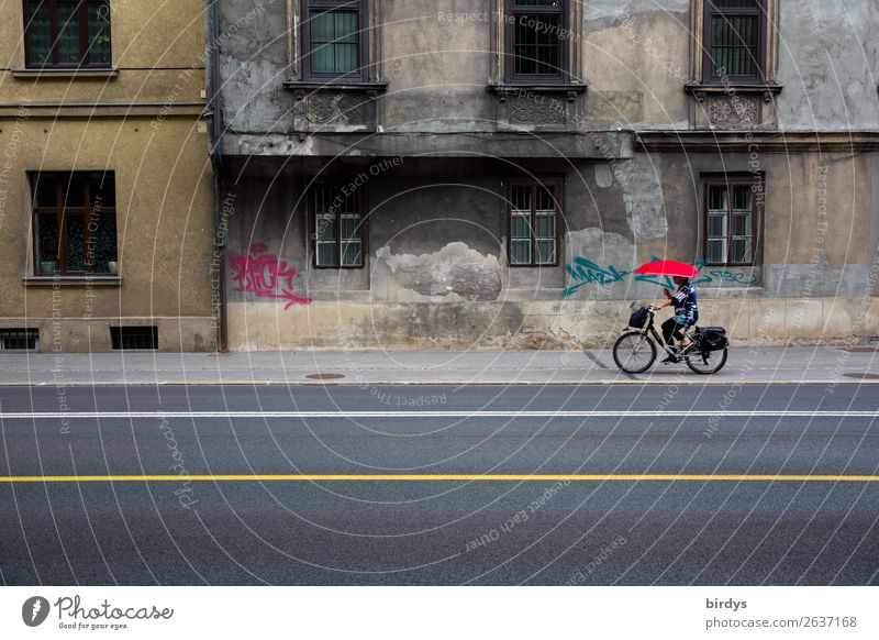 urban contrasts Cycling Bicycle Feminine Woman Adults 1 Human being 45 - 60 years Capital city Old town House (Residential Structure) Manmade structures Facade