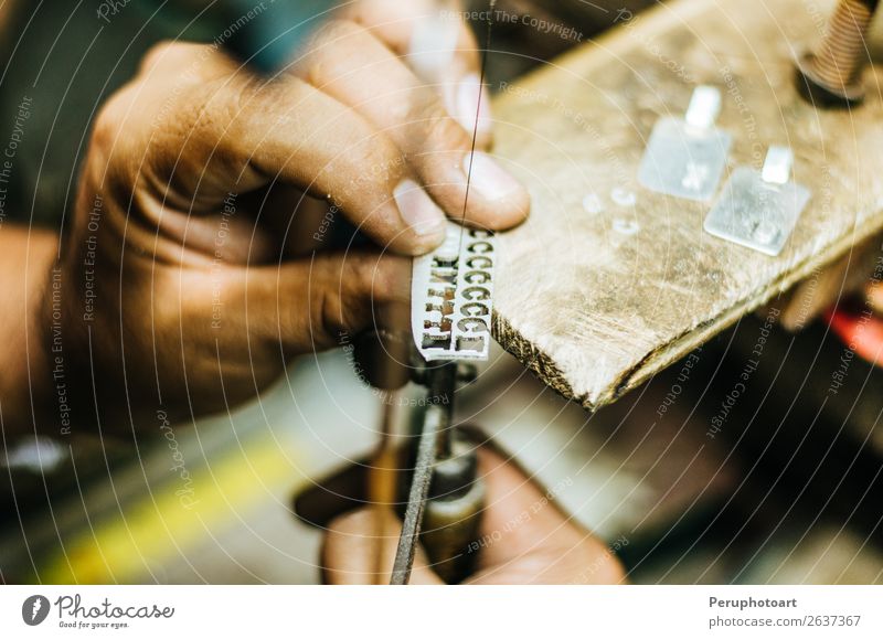 man's hands goldsmith work on a piece of silver Design Handicraft Work and employment Profession Workplace Industry Craft (trade) Tool Saw Human being Woman