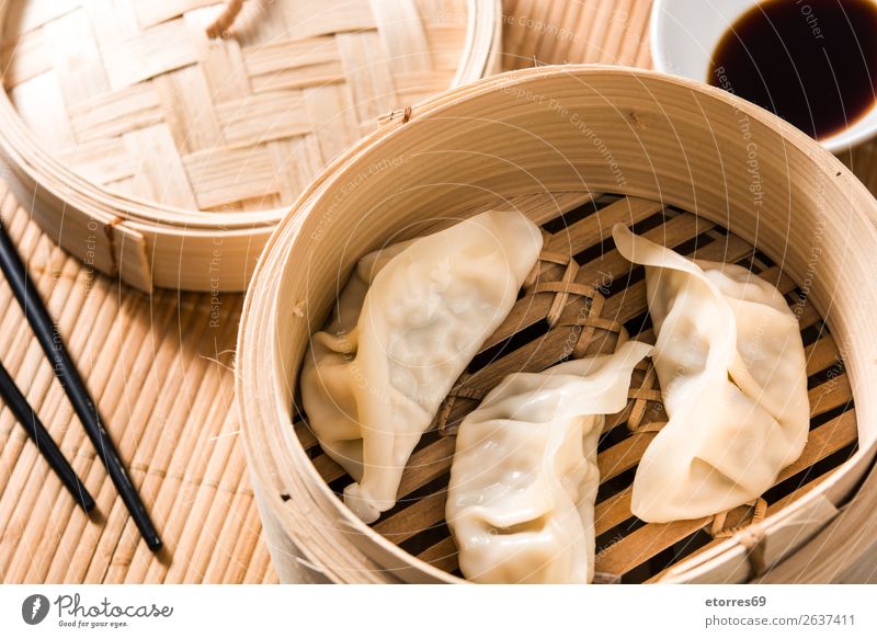 Dumplings or gyoza served in traditional steamer Japanese Chinese Oriental Food Healthy Eating Food photograph Tradition Soja-bean sprout Soy bean Meal Asia