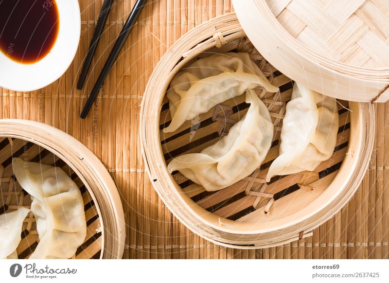 Dumplings or gyoza served in traditional steamer Japanese Chinese Oriental Food Healthy Eating Food photograph Tradition Soja-bean sprout Soy bean Meal Asia