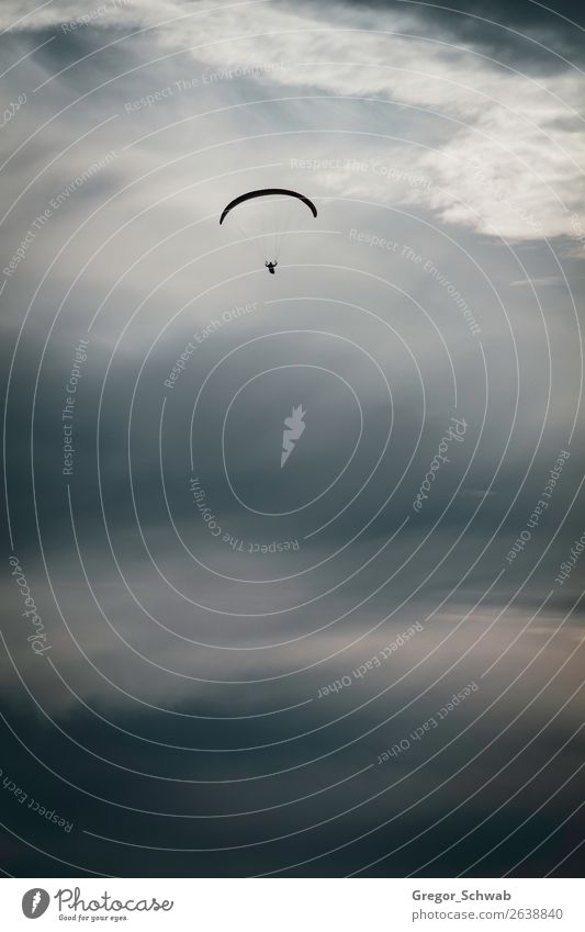 Lonely flight Storm Brave Safety Safety (feeling of) Paragliding Paraglider Clouds Sunset Dramatic art Freedom Flying Rhoen Wasserkuppe Exterior shot Twilight