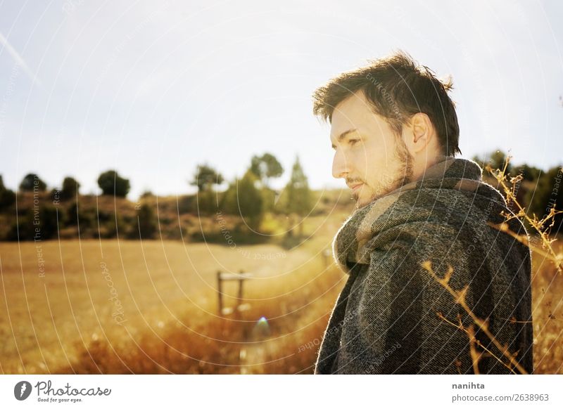 Side portrait of a young man enjoying the morning Lifestyle Happy Face Relaxation Calm Freedom Sunbathing Man Adults Sky Autumn Grass Scarf To enjoy Yellow
