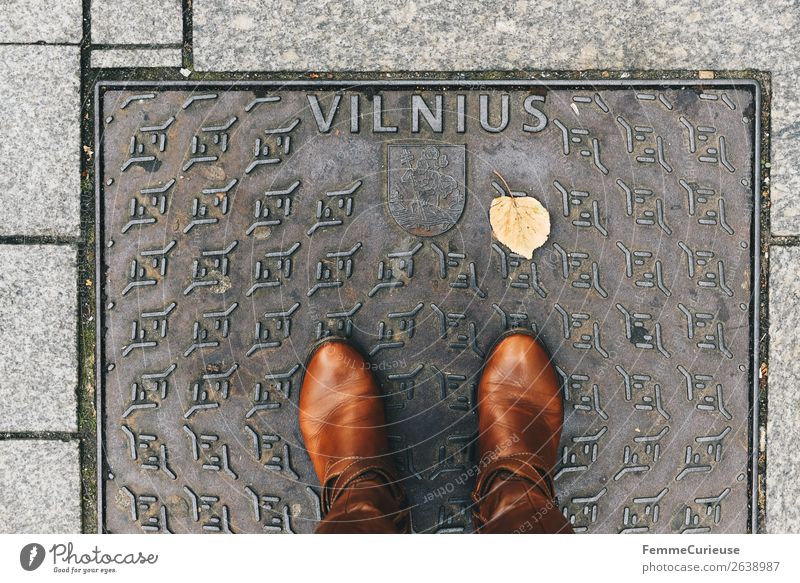 Person with brown boots standing on a manhole cover in Vilnius Lifestyle Feminine Young woman Youth (Young adults) Woman Adults 1 Human being Vacation & Travel