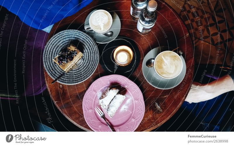 Top view of a table in a café Lifestyle To enjoy Coffee To have a coffee Coffee cup Cake Baked goods Dessert Café Afternoon Eating Candle Cozy Wooden table