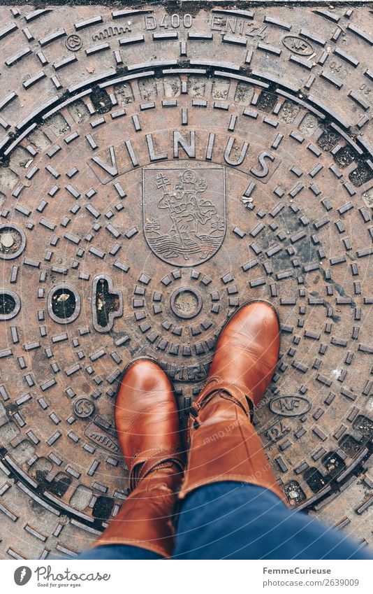 Person with brown boots standing on a manhole cover in Vilnius Feminine Young woman Youth (Young adults) Woman Adults Feet 1 Human being 18 - 30 years