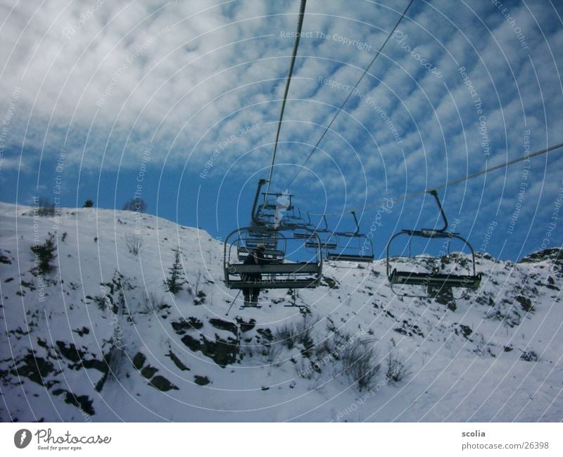 Lift to the sky Skis Ski lift Clouds Altocumulus floccus Mountain skift Sky Blue