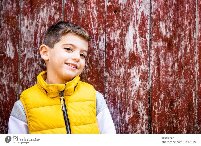 Little kid with a yellow vest in front of an old red door Lifestyle Style Happy Beautiful Face Child Human being Baby Toddler Boy (child) Infancy 1 3 - 8 years