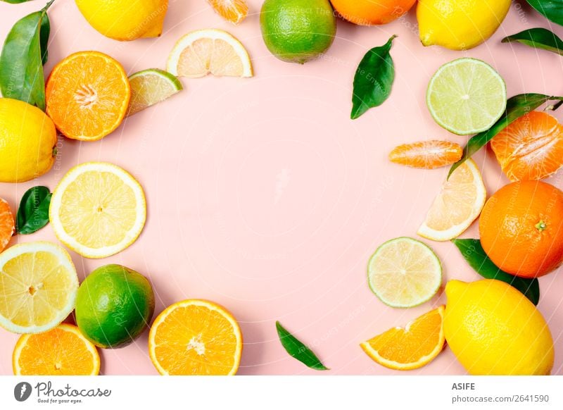 Citrus fruits frame on pink background Fruit Nutrition Beverage Lemonade Juice Summer Leaf Fresh Above Yellow Green Pink lime orange Tangerine citrus drink food