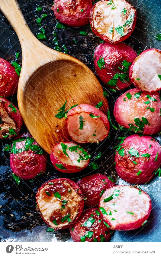Roasted radishes in a pan Vegetable Nutrition Vegetarian diet Diet Pan Spoon Plant Wood Fresh Small Delicious Red Colour radished roasted Root cooking Wok