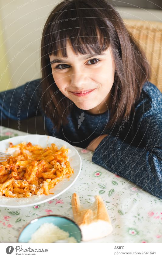 Happy little girl enjoying pasta Cheese Nutrition Eating Lunch Dinner Fork Joy Beautiful Table Kitchen Child Smiling Sit Delicious Cute Appetite Macaroni penne