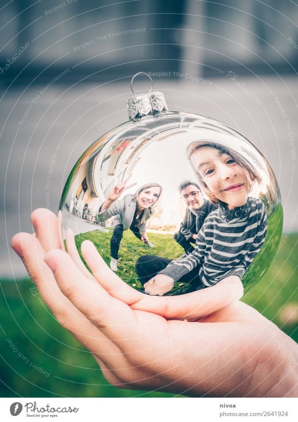 Family in Christmas tree ball Winter Human being Masculine Feminine Child Boy (child) Woman Adults Man Parents 3 8 - 13 years Infancy 30 - 45 years