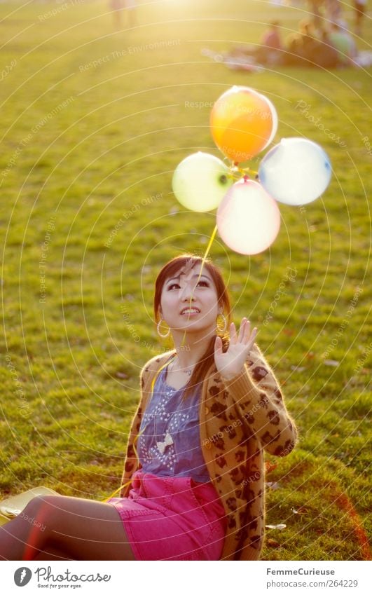 Spring Spring Spring XI Young woman Youth (Young adults) Woman Adults Hand 1 Human being 18 - 30 years Joy Balloon Asians Park Meadow Spring fever Sit Playing