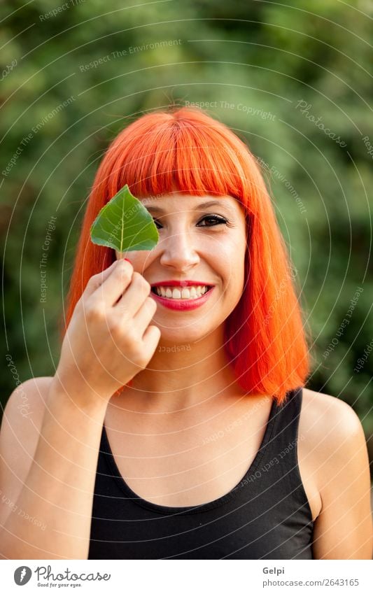 Red hair girl with a tree leaf Lifestyle Happy Beautiful Face Make-up Human being Woman Adults Nature Autumn Leaf Park Forest Fashion Smiling Happiness Colour